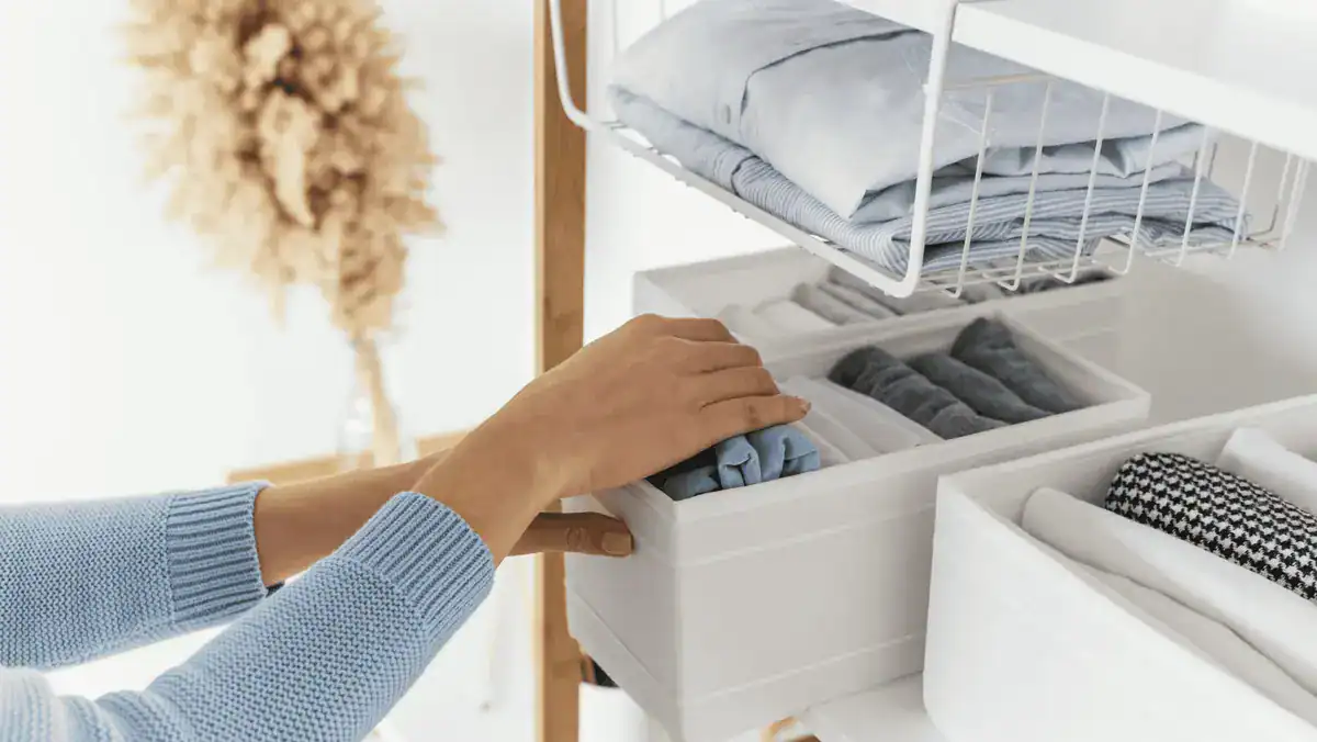 organizing clothes in baskets